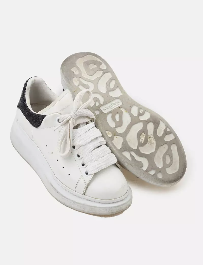 White Alexander McQueen casual sneakers.