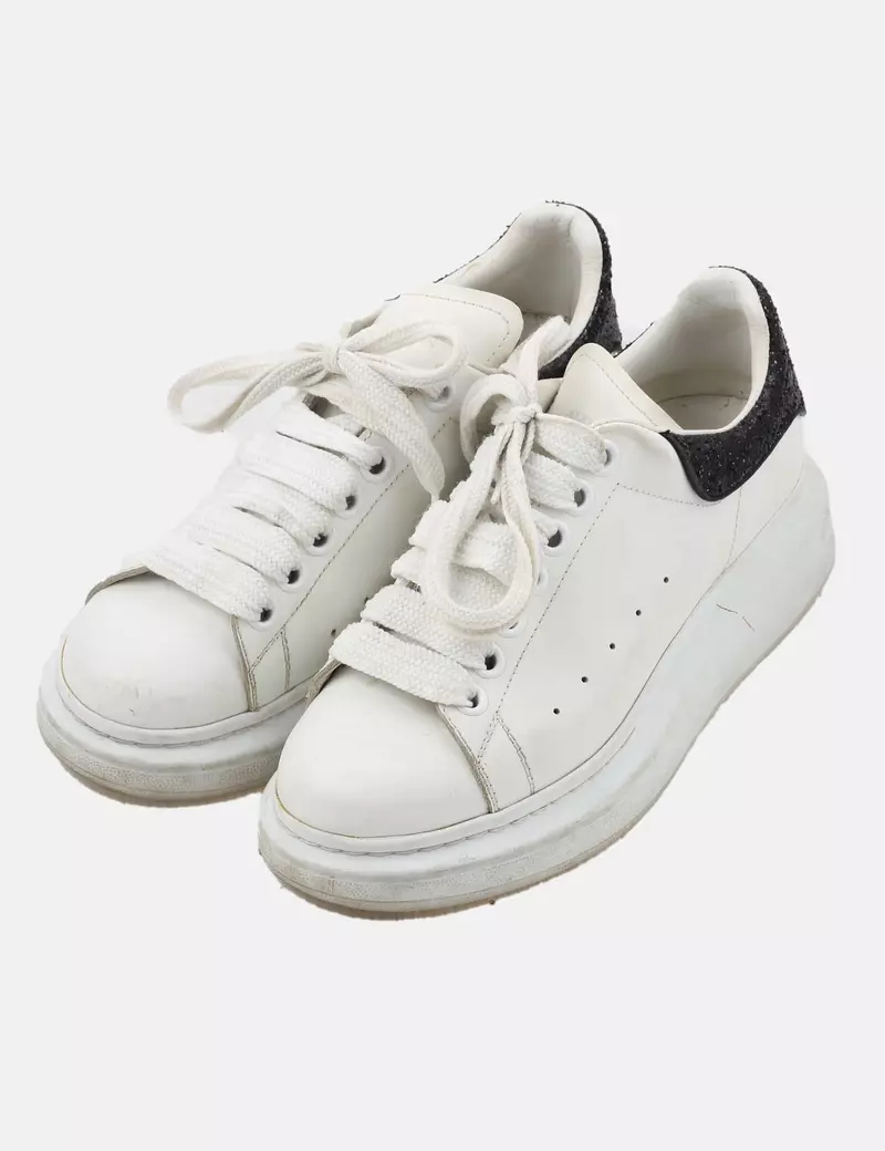 White Alexander McQueen casual sneakers.