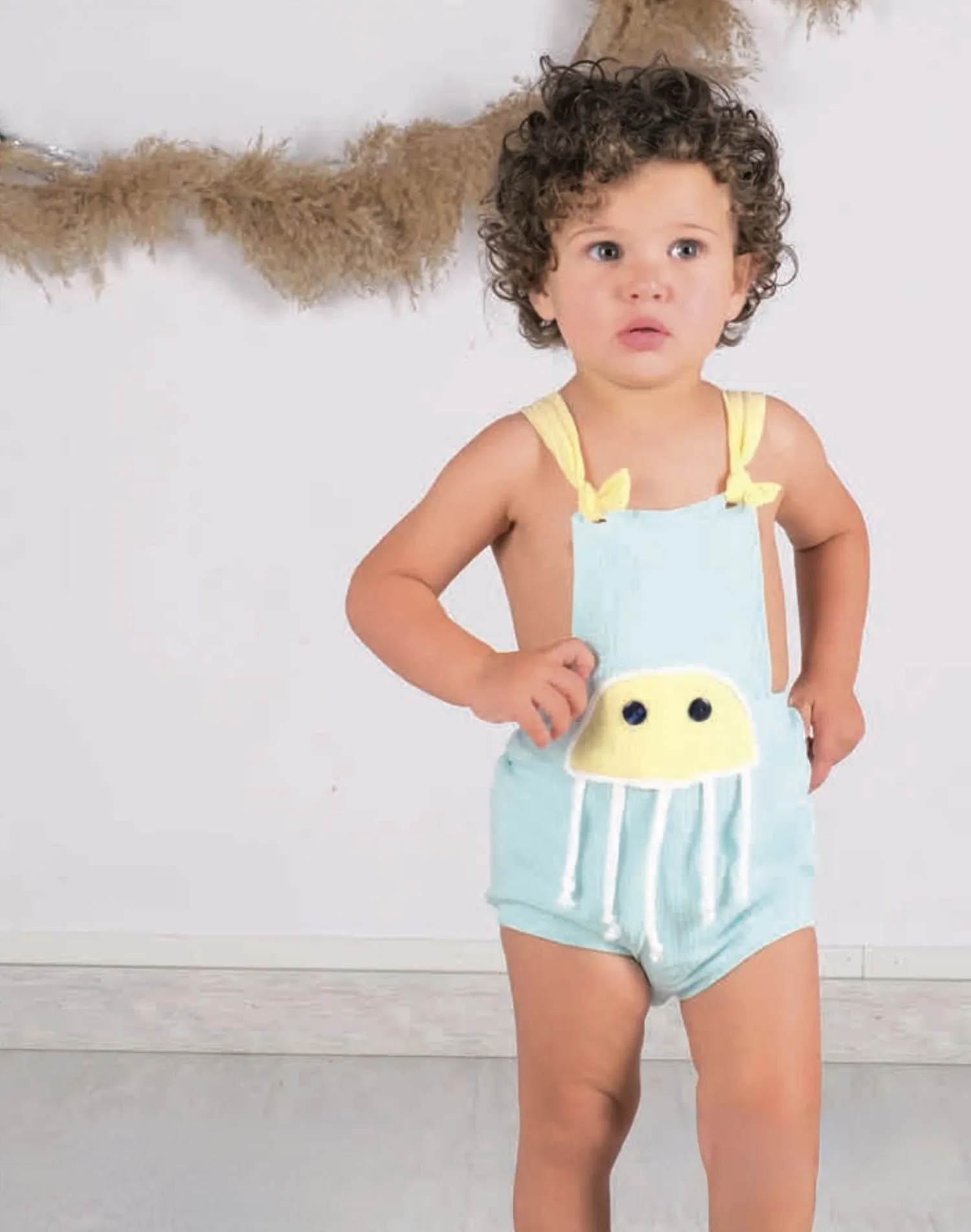 Olivia Collection unisex muslin romper.